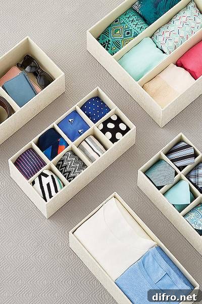 organized storage boxes with clothing inside