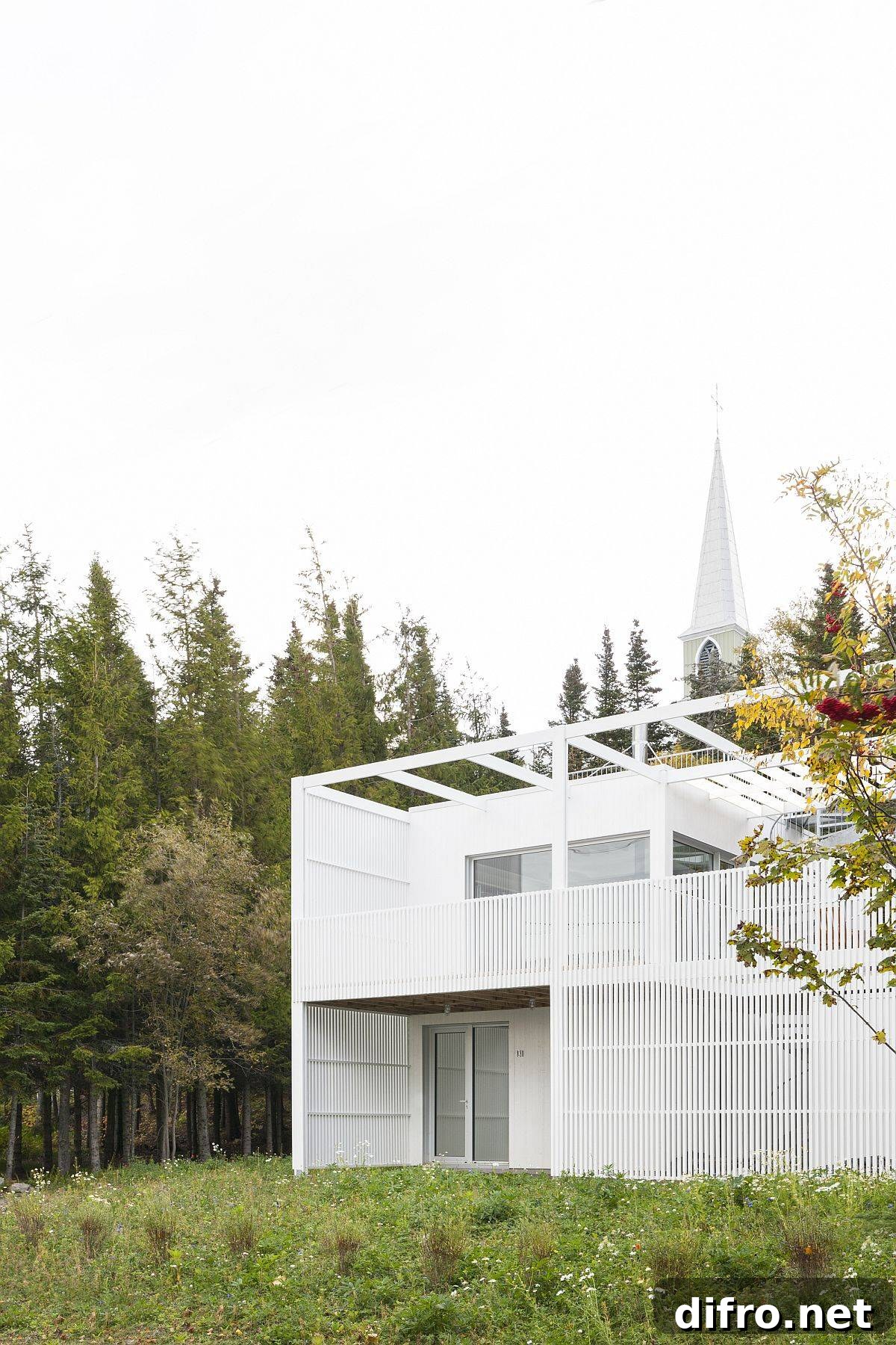 Gorgeous small white house set among natural greenery with a fluid modern design