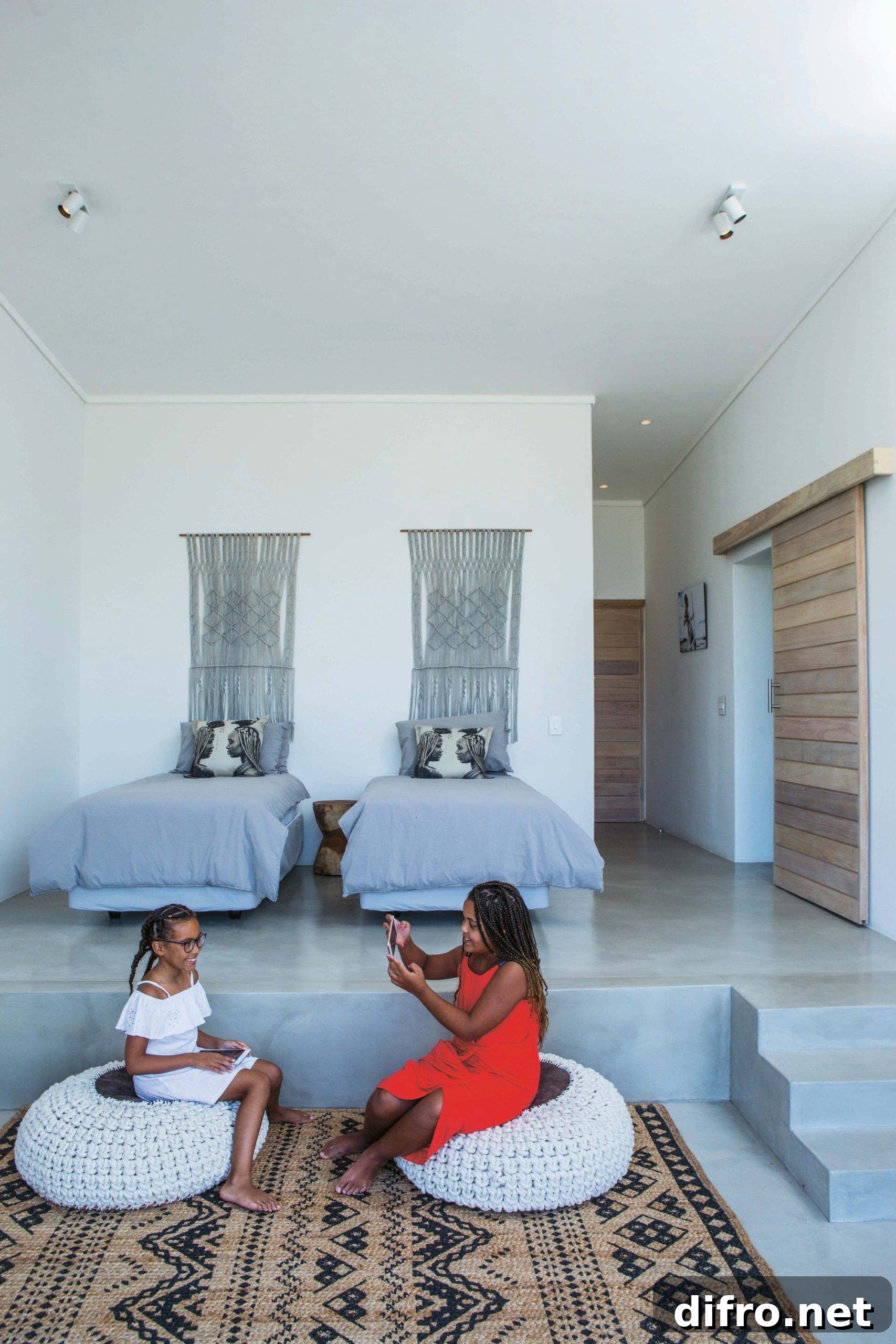 Multi-level interior with neutral hues and patterned rug at Imbizo House