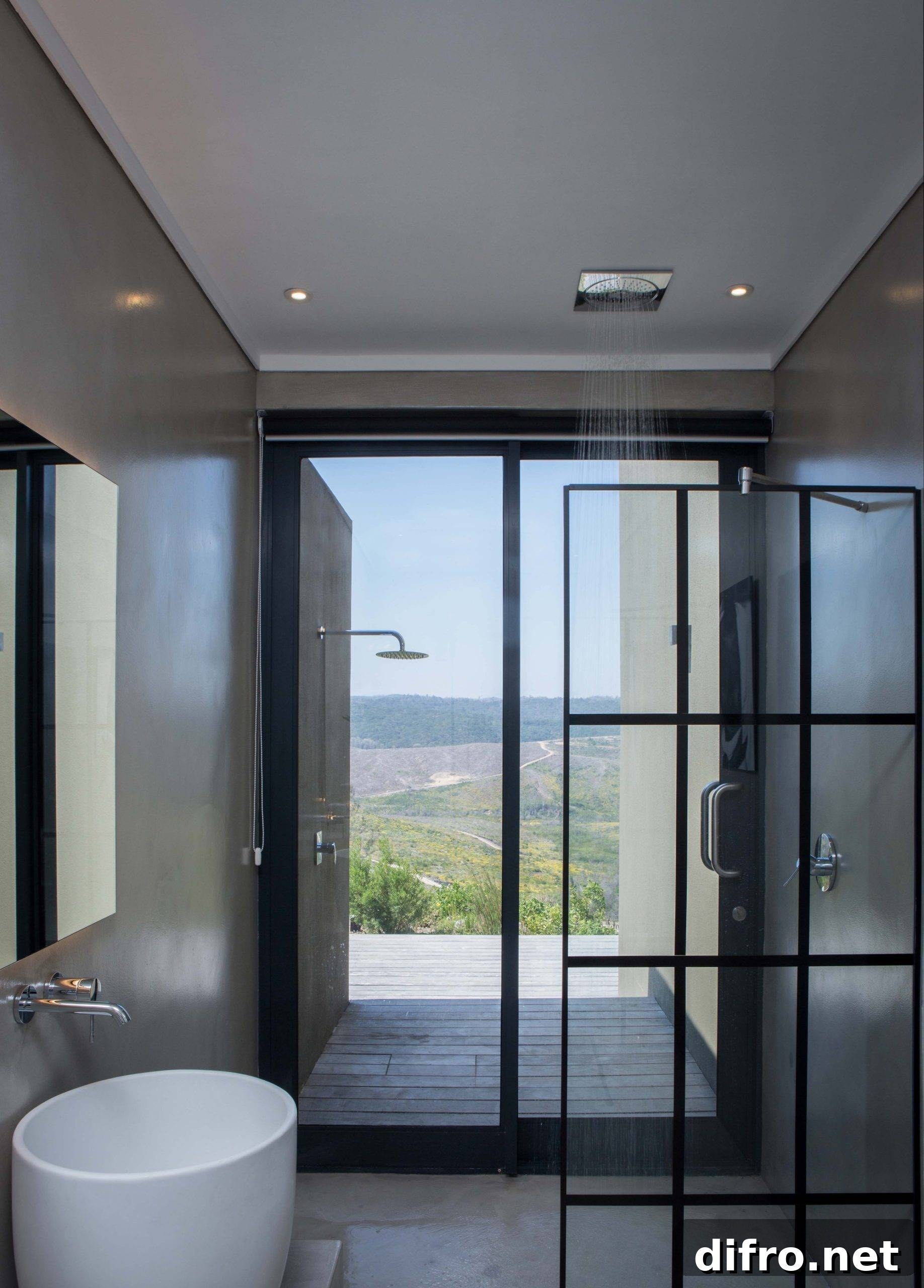 Contemporary bathroom with glass partition and wall-mounted plants