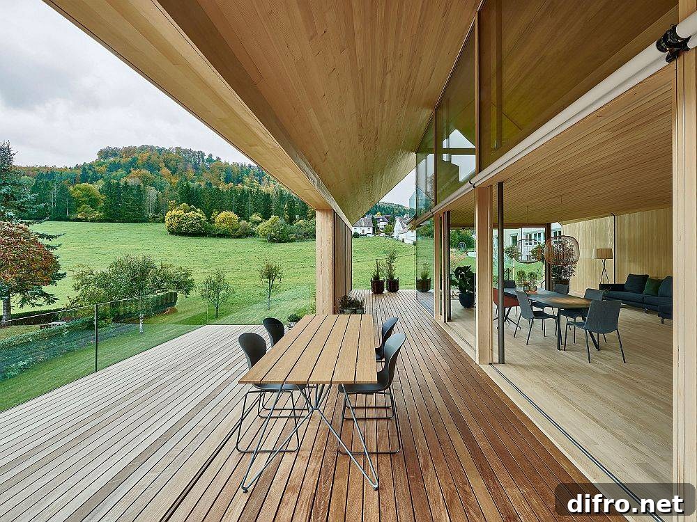 View of lush green landscape from wooden deck