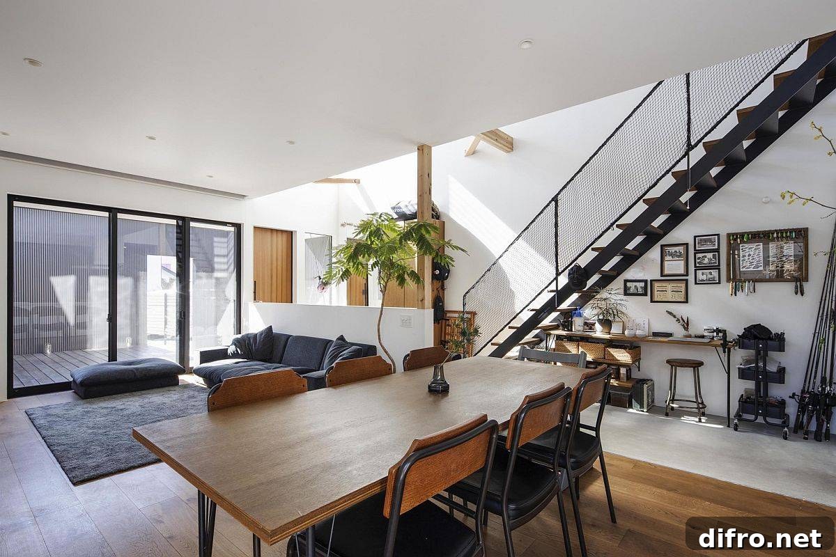 Living area and dining room in white, gray and wood
