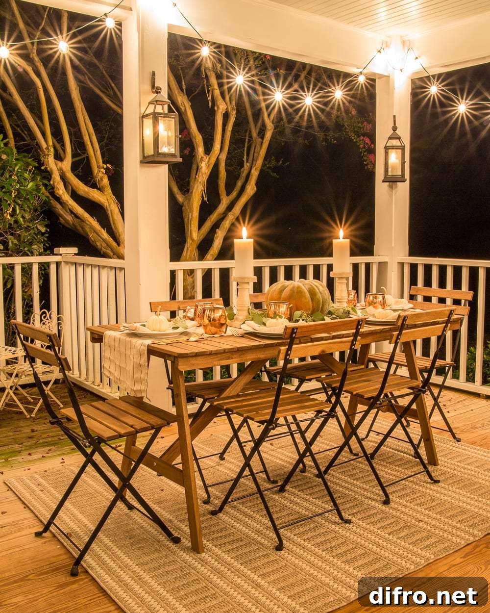 Table with pumpkin and two candles