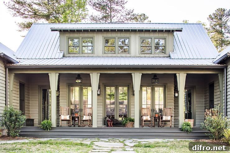 Green country cabin porch looks cozy and inviting with rocking chairs placed in front of a row of French doors.