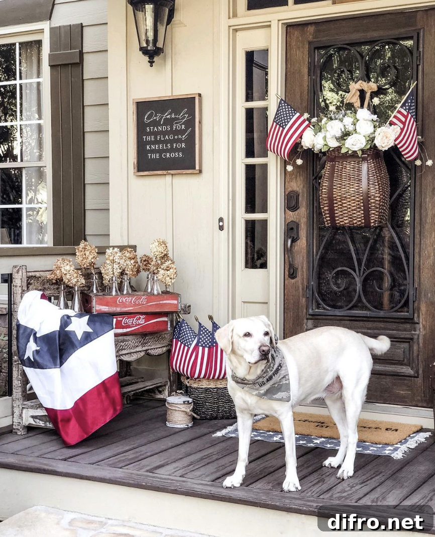 patriotic theme front porch with american flags and dog white lab with bandana on basket door decor with flags and flowers