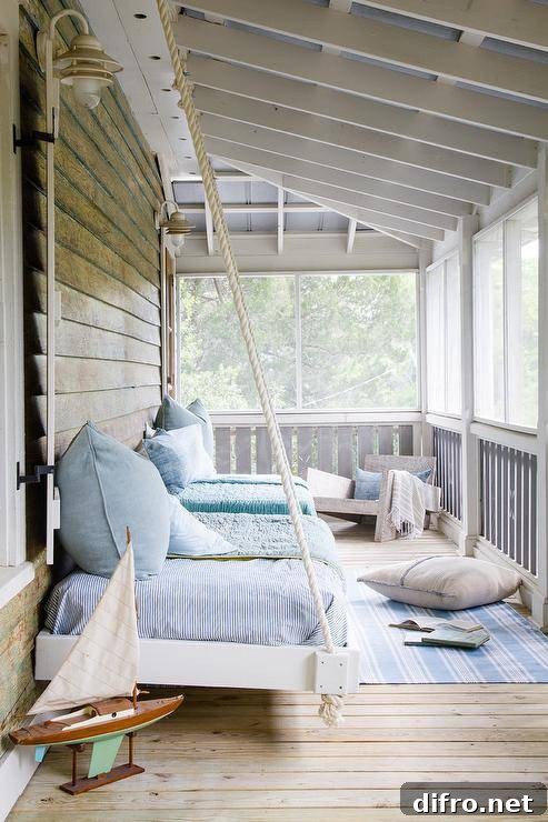 front porch with hanging bed swing blue coastal feel sailboat rub