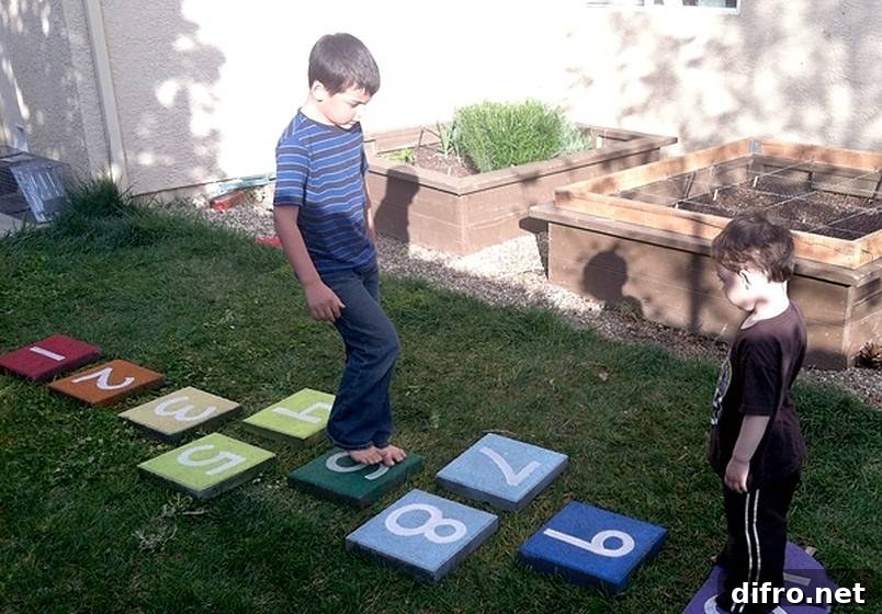 Two boys playing on hopscotch tiles