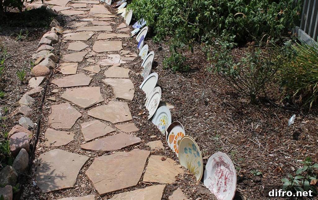 Old china plates edging a pathway