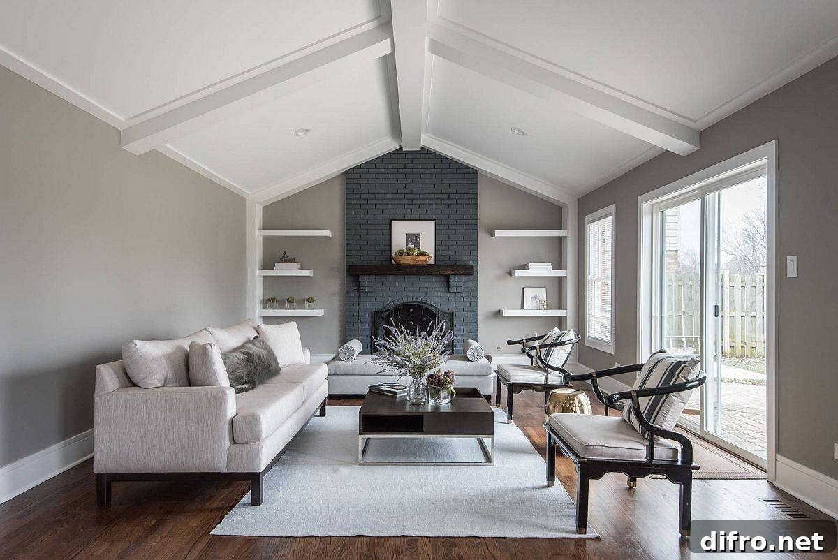 double-height living room with gray painted brick fireplace