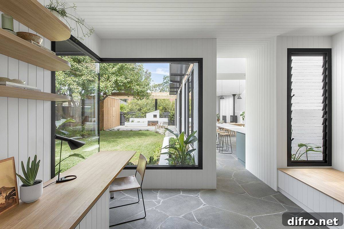 Home office in wood and white with a garden view