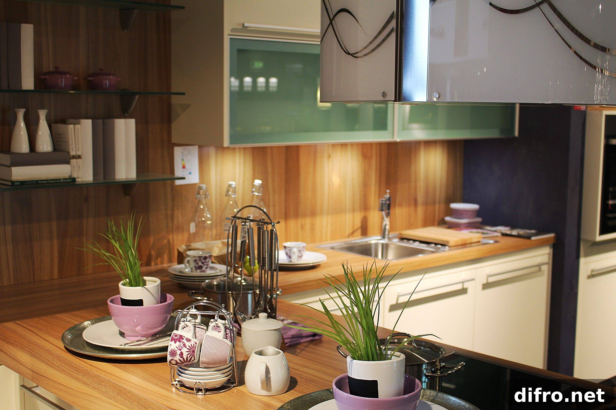 Kitchenware on counter with two potted plants