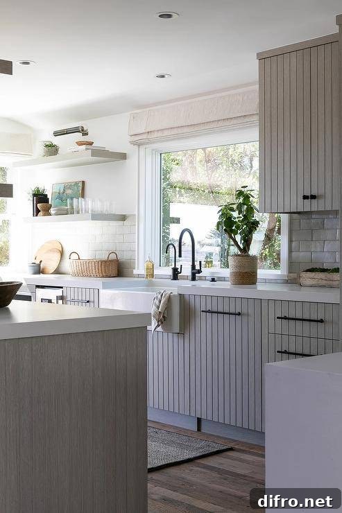 Gray shelves and farmhouse sink in a cottage kitchen.