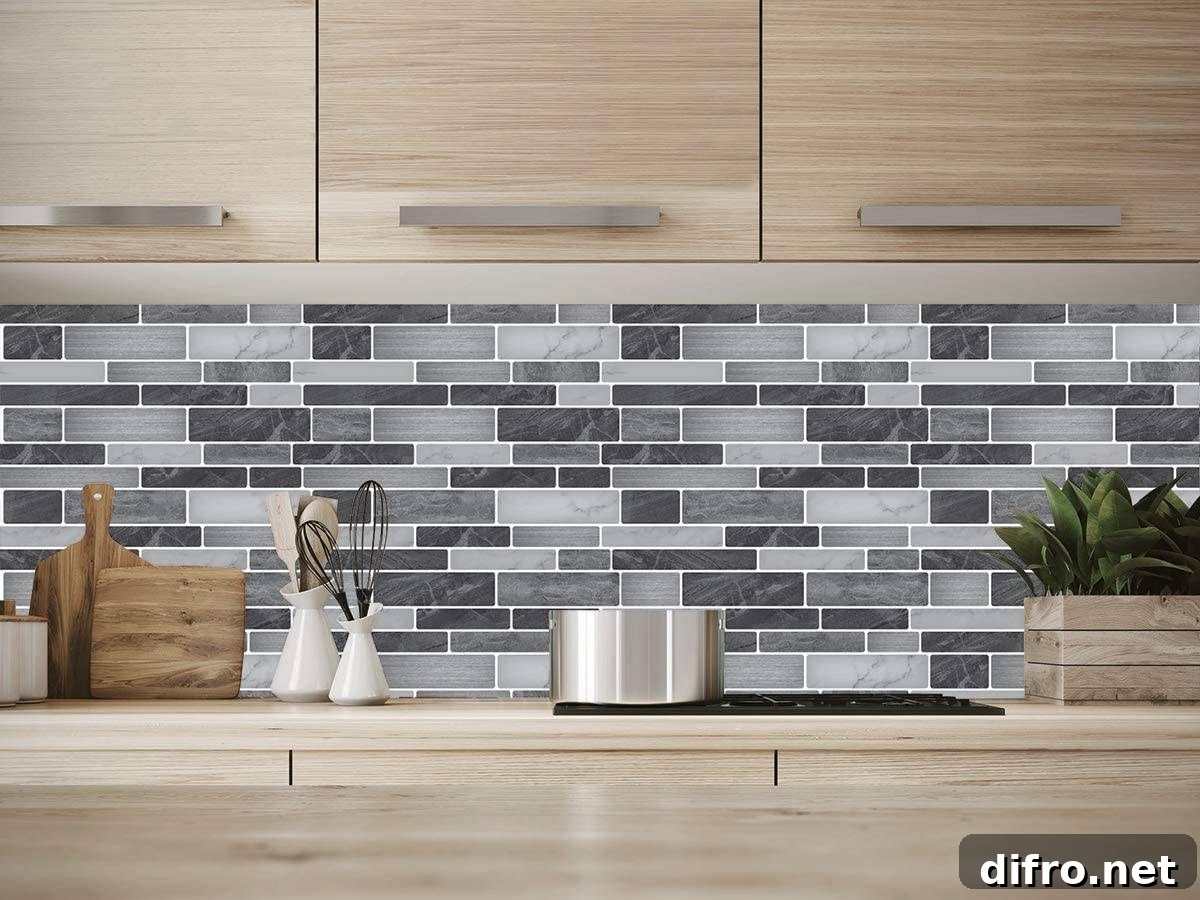 Vinyl decorative tiles in different grey hues on a kitchen wall.