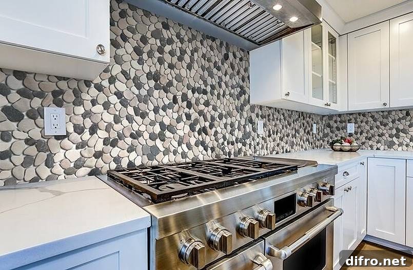 Natural stone pebbles on kitchen wall.