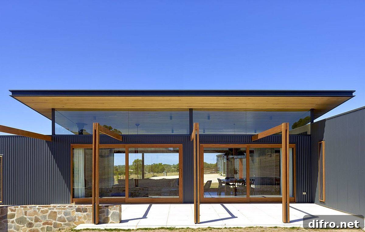 Timber glass and corrugated steel shape the exterior of this modern-rustic Aussie home