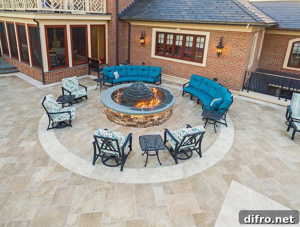 Fire pit surrounded by blue chairs and sofas