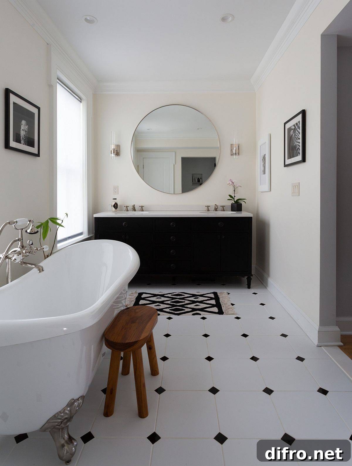 Black vanity and accents in an all-white bathroom