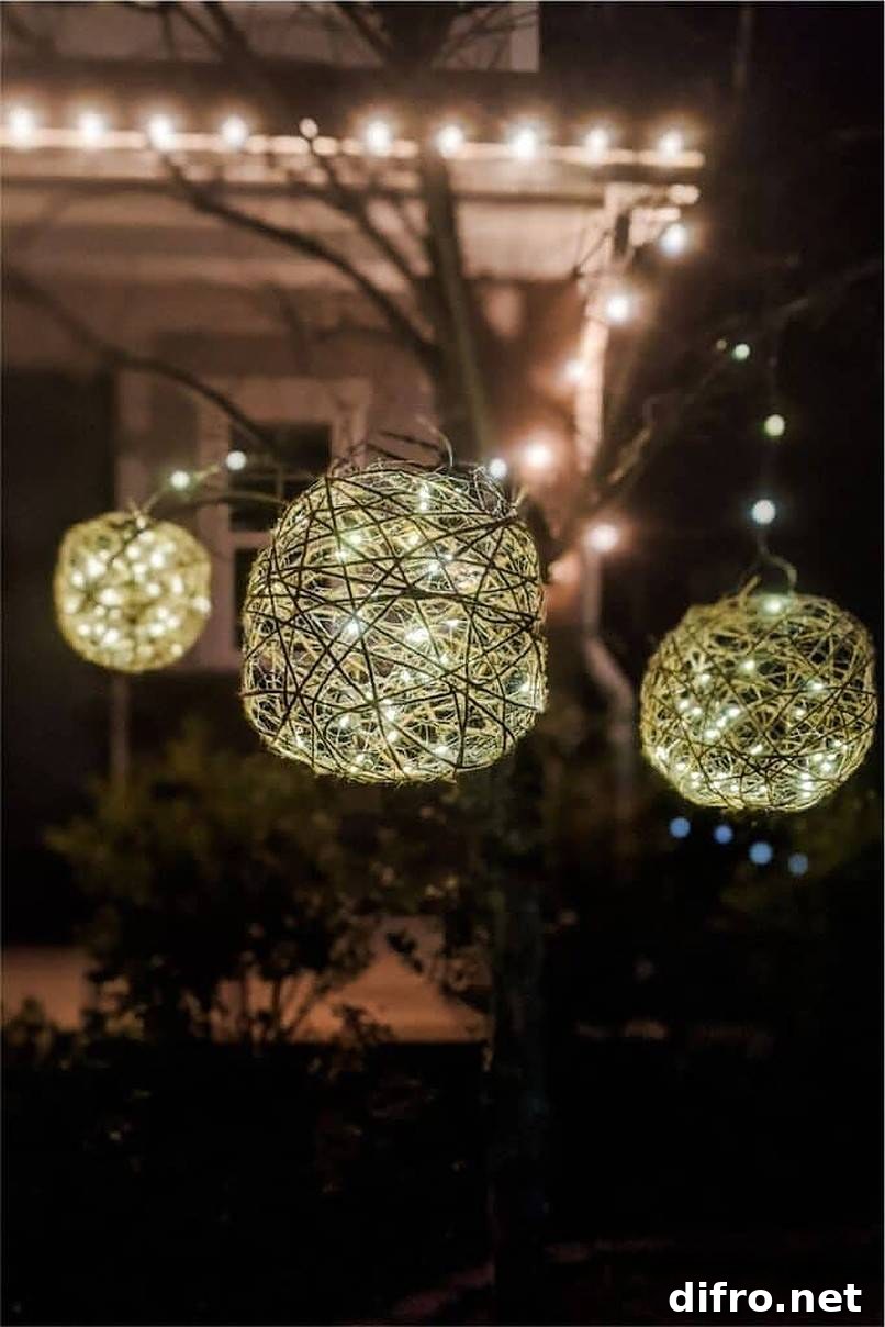 Three balled outdoor lights hanging from tree