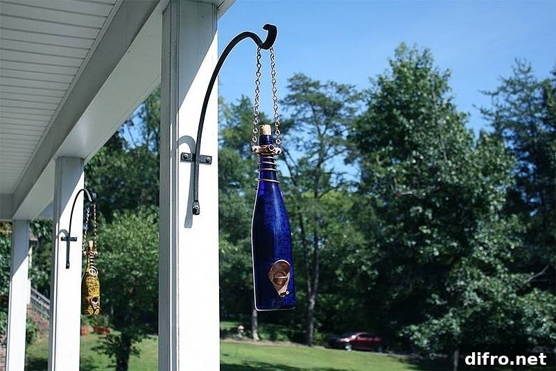Bottles hanging from house pillars