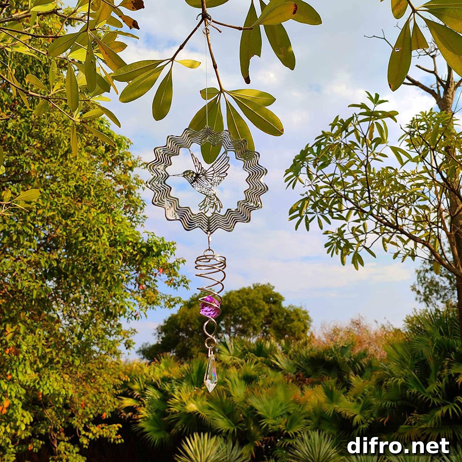 Bird wind spinner hanging from a tree branch