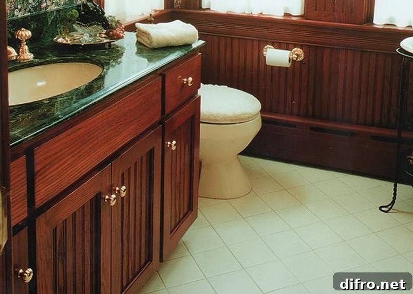 Bathroom sink in dark green and brown cabinetry
