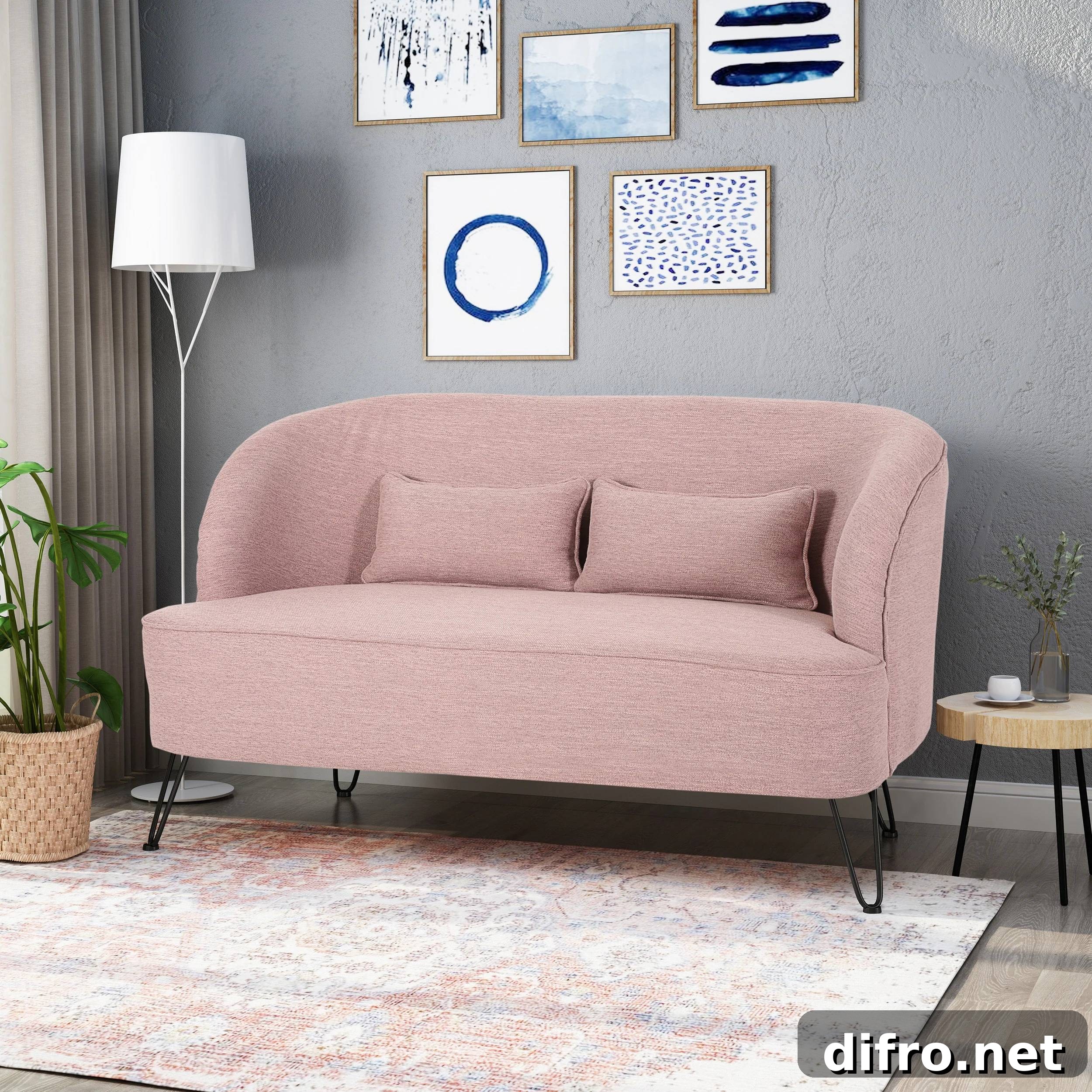 Pink sofa beside tall white lampshade