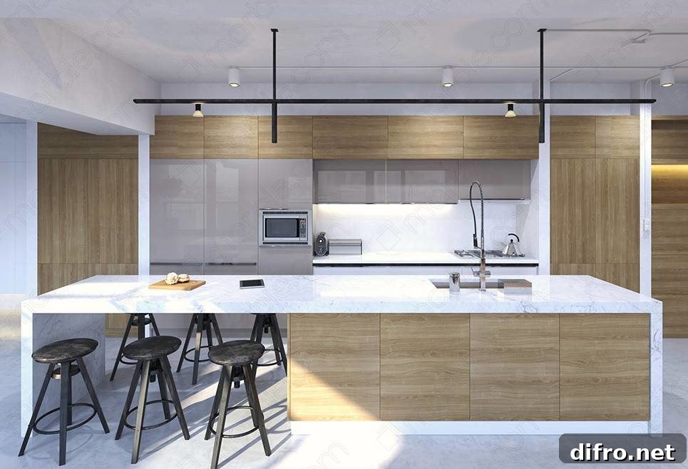 Black stools beside long kitchen island