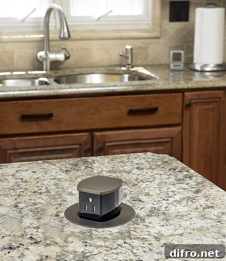 Pop up outlet installed into counter in matte black