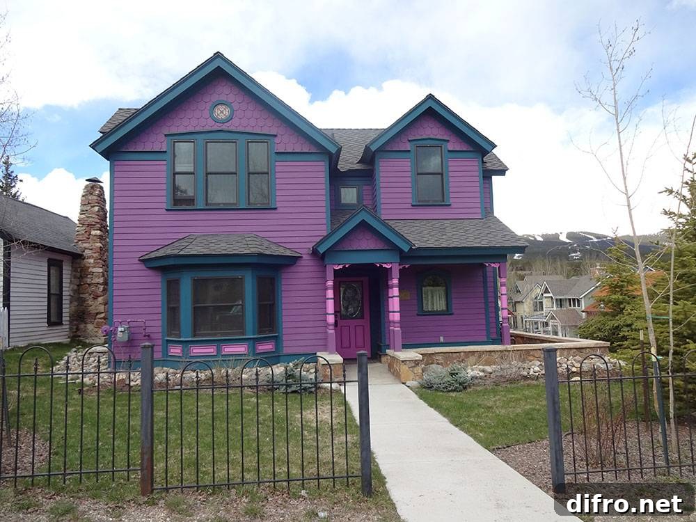 Lavender house facade with steel fence