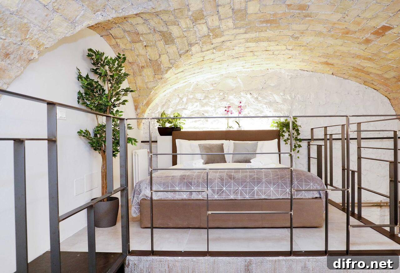 Loft bed with open brick cathedral ceiling