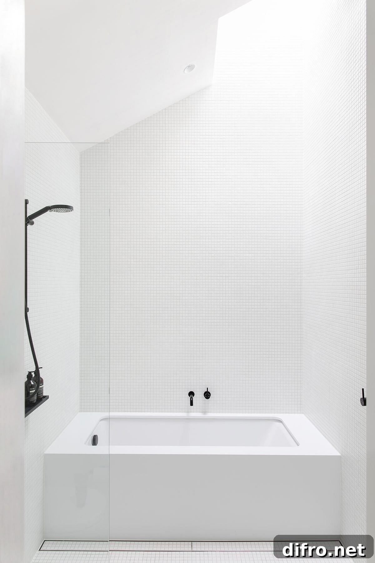 Exquisite contemporary monochromatic bathroom in white with natural light