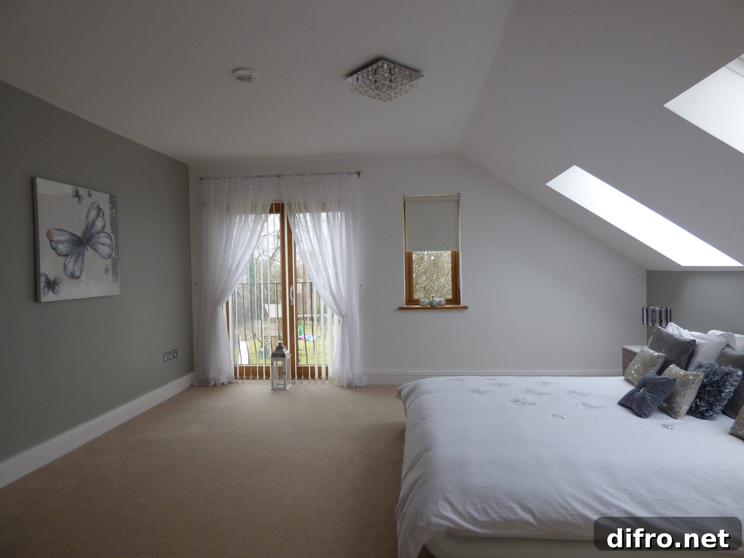 Spacious grey bedroom with large bed
