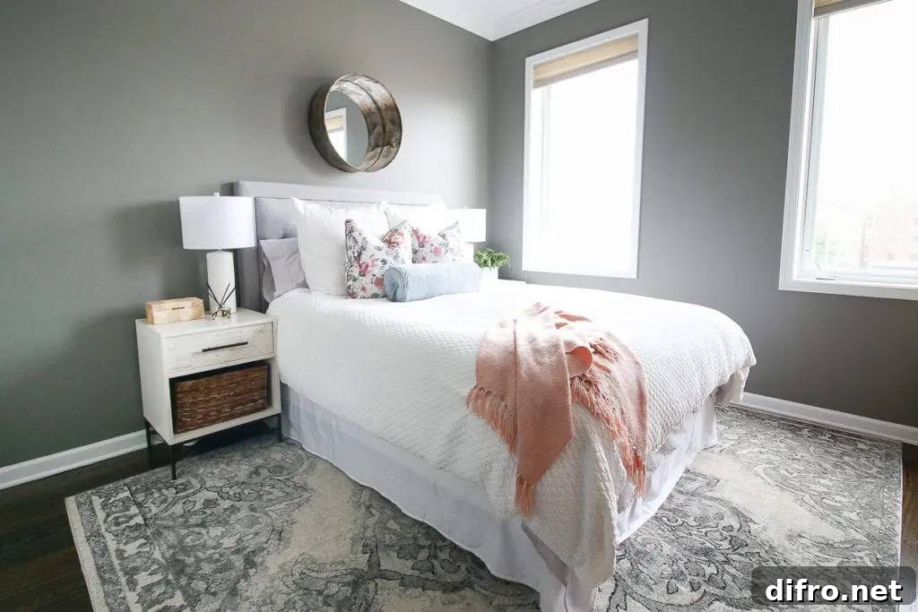 Fringed shawl on top of white bed