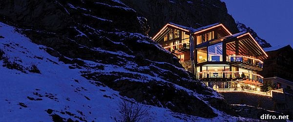 Interior living space with large windows at Chalet Zermatt Peak