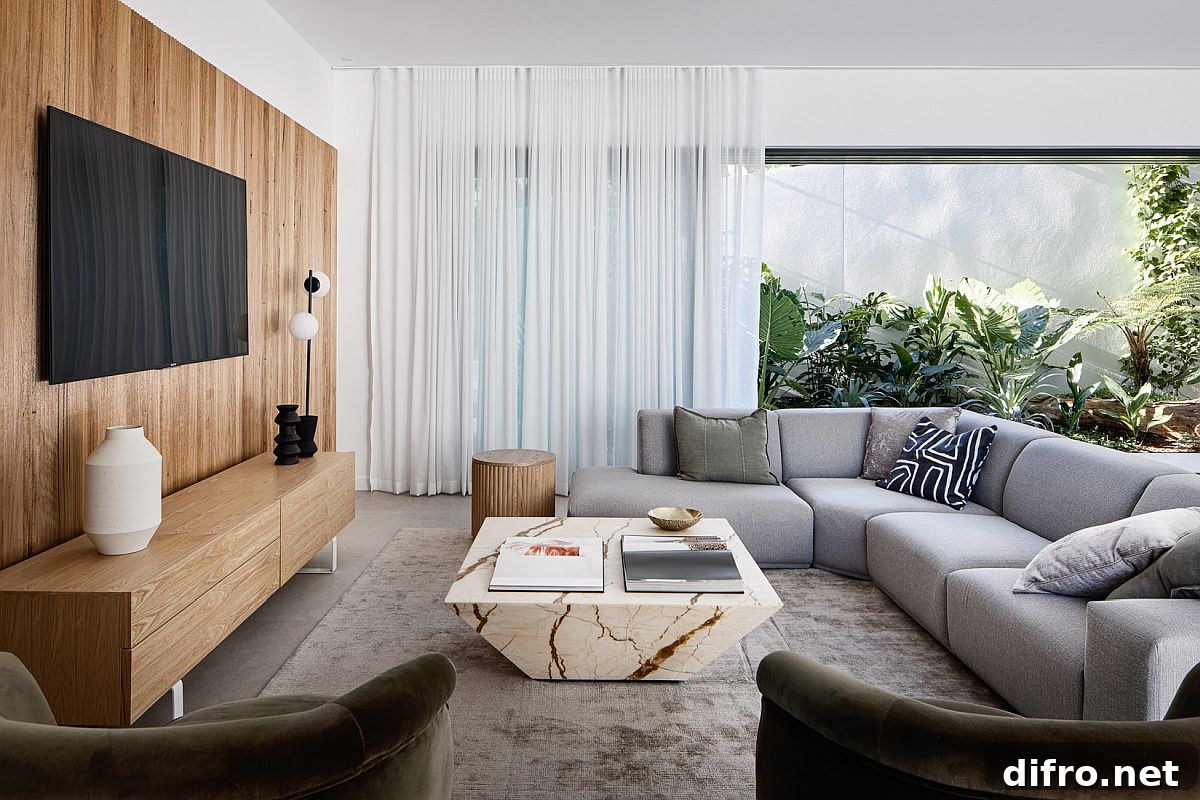 Wooden accent wall, entertainment unit and marble coffee table