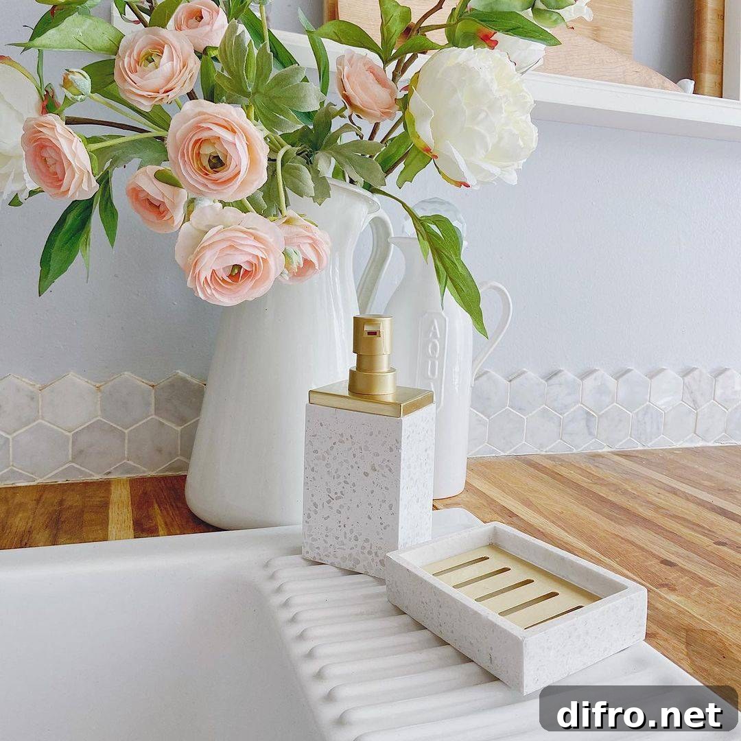 Pink roses on white vase beside sink