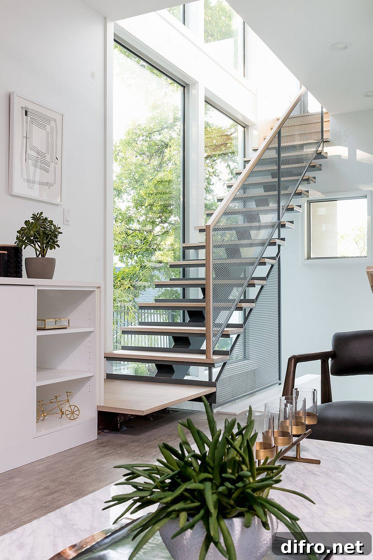 Slim and stylish modern stairway with wooden treads and metallic mesh railing