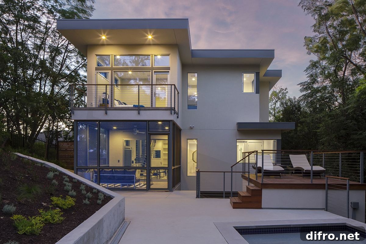 View of the rear section of the Rutherford Residence in Austin, Texas with a contemporary deck and pool