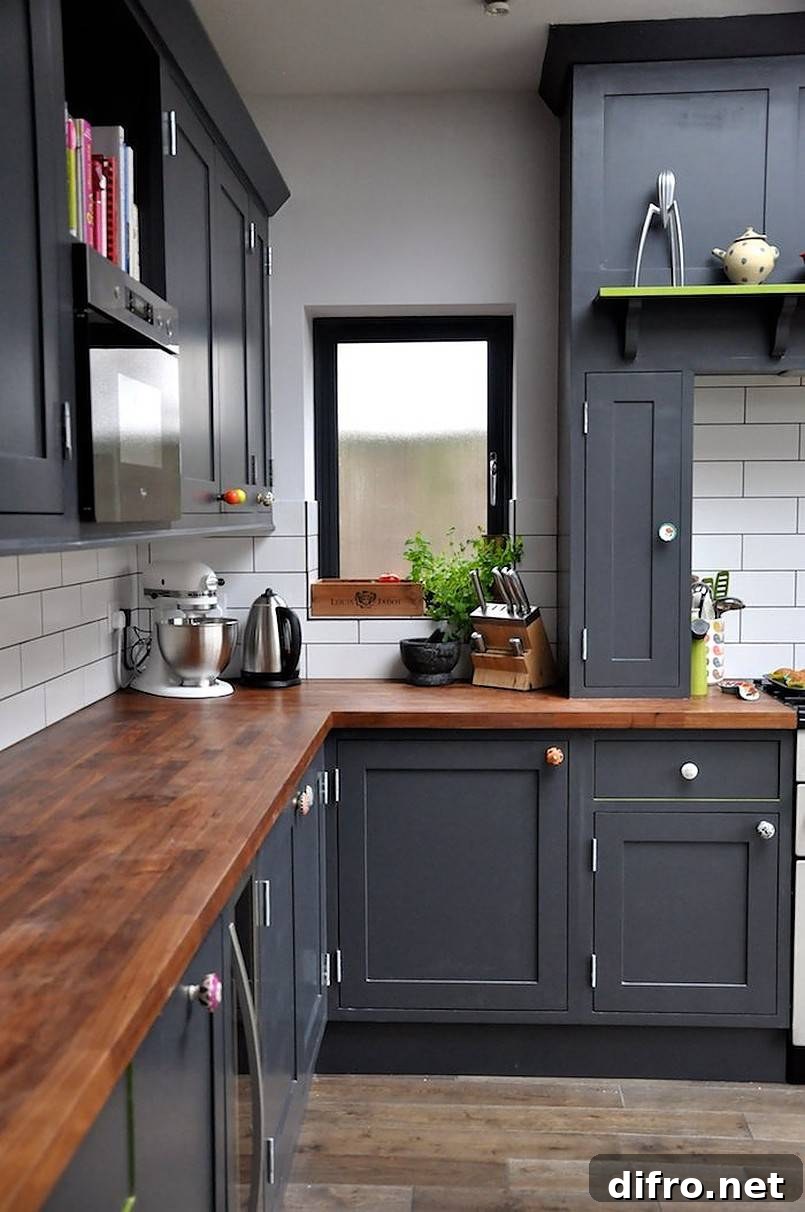 Gray kitchen cabinets and butcher block countertop