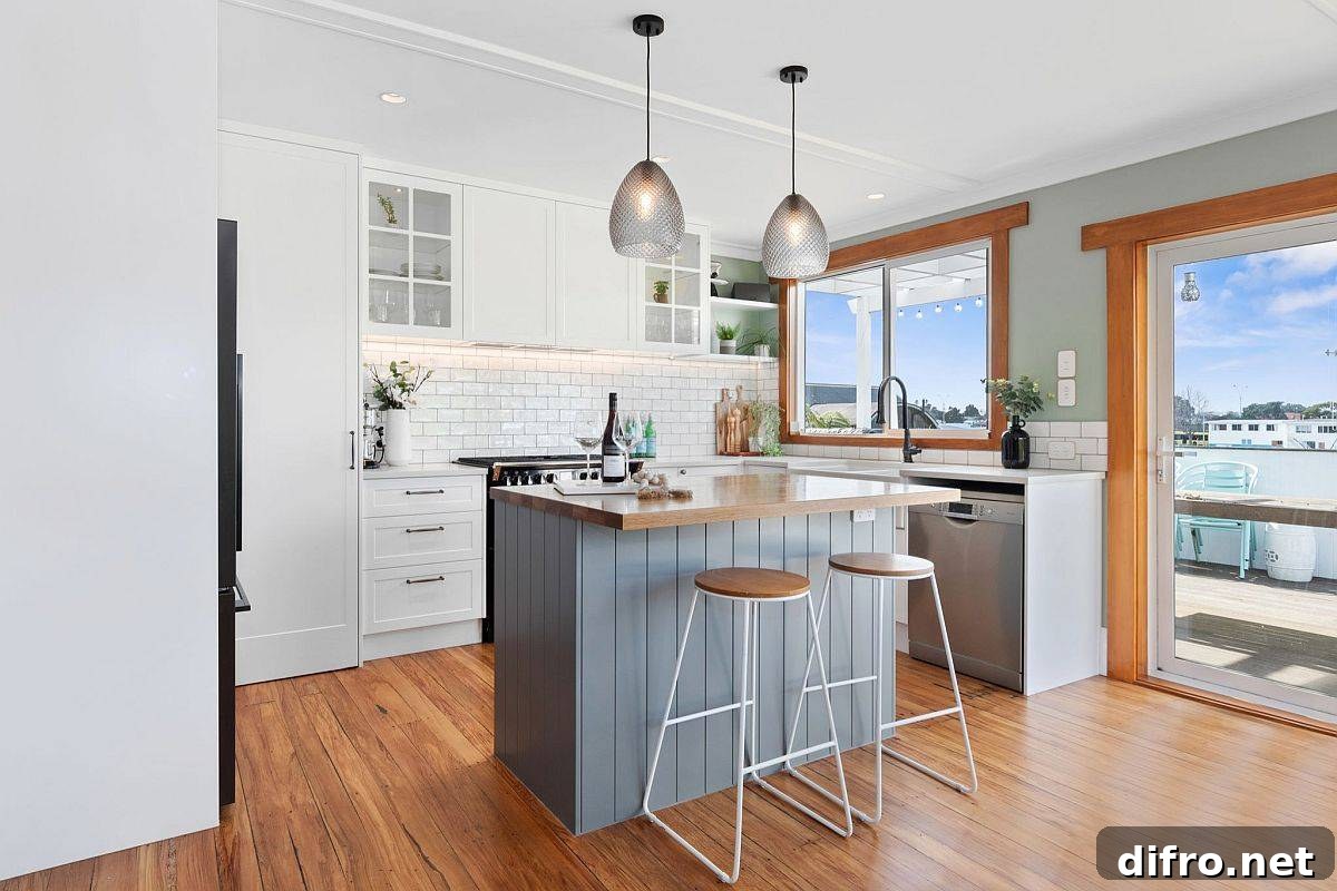 Light grayish-blue kitchen island for a beach style kitchen
