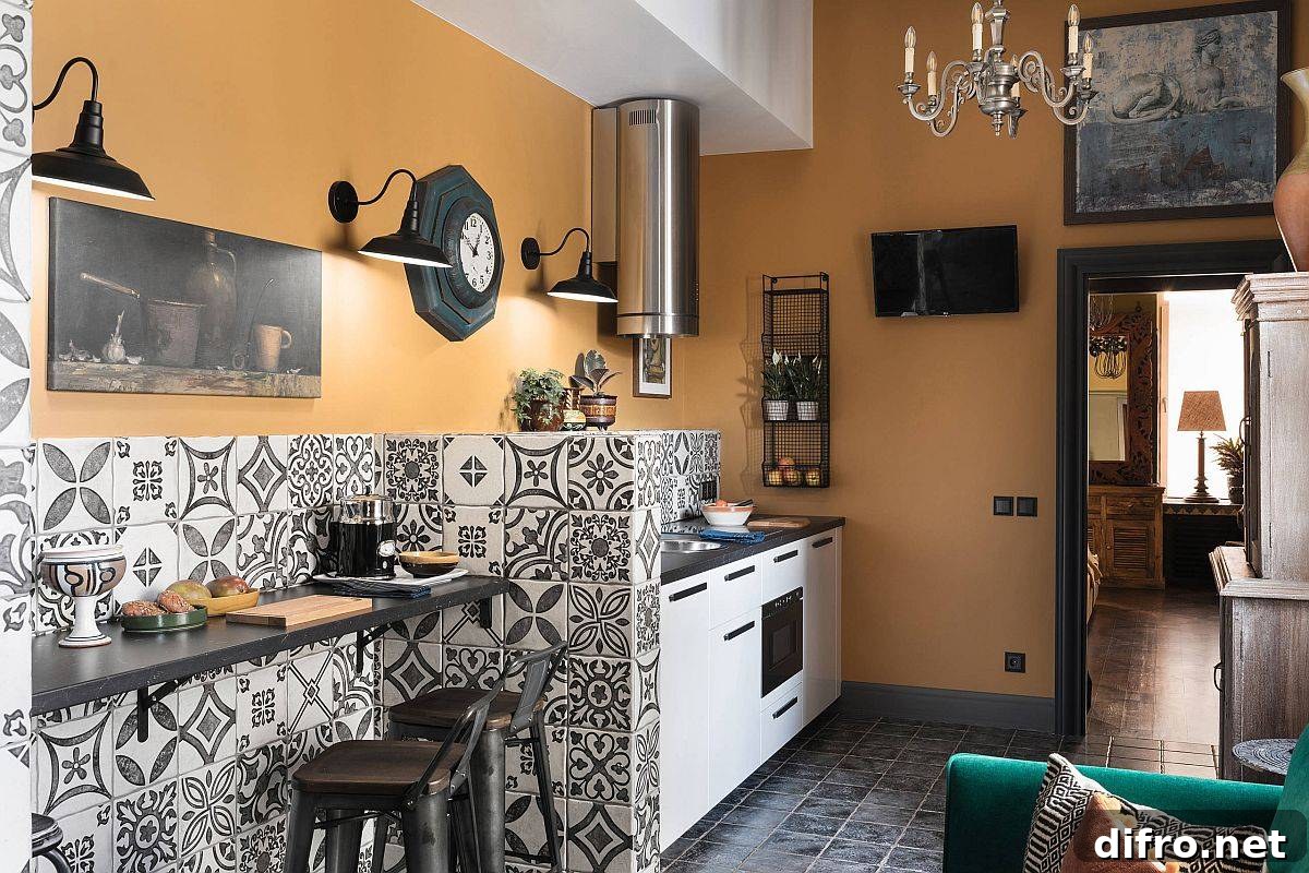 Patterned tiles and cozy yellow walls for a Mediterranean kitchen