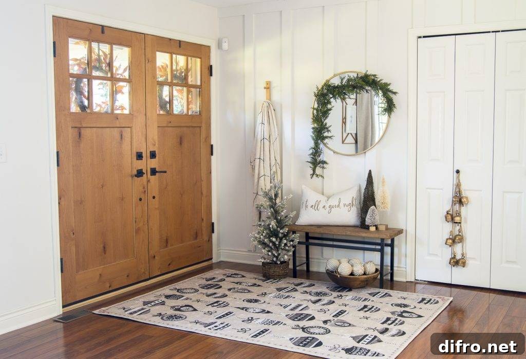 Round mirror with garland in entryway