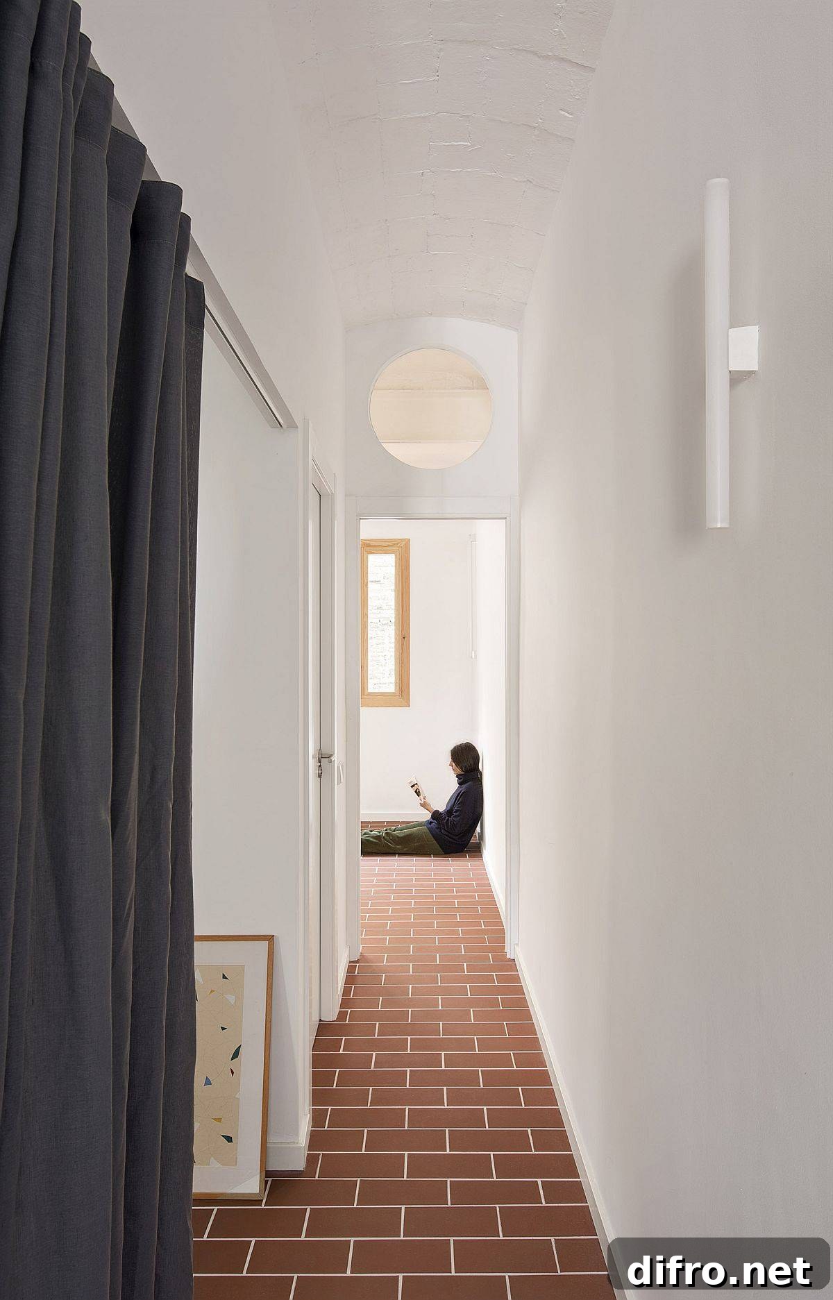 A once-dark corridor transformed into a bright, light-filled transition