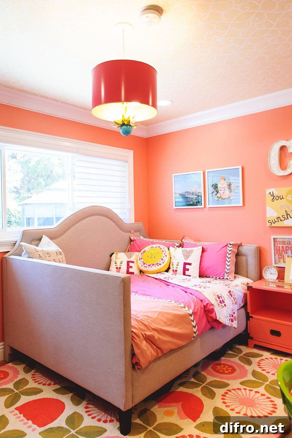 Charming orange backdrop in the kids’ bedroom with wallpapered ceiling and smart pendant light