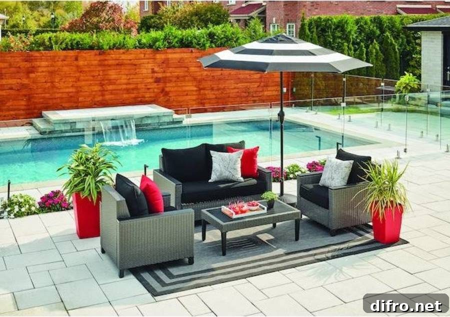 striped umbrella covering dark patio furniture