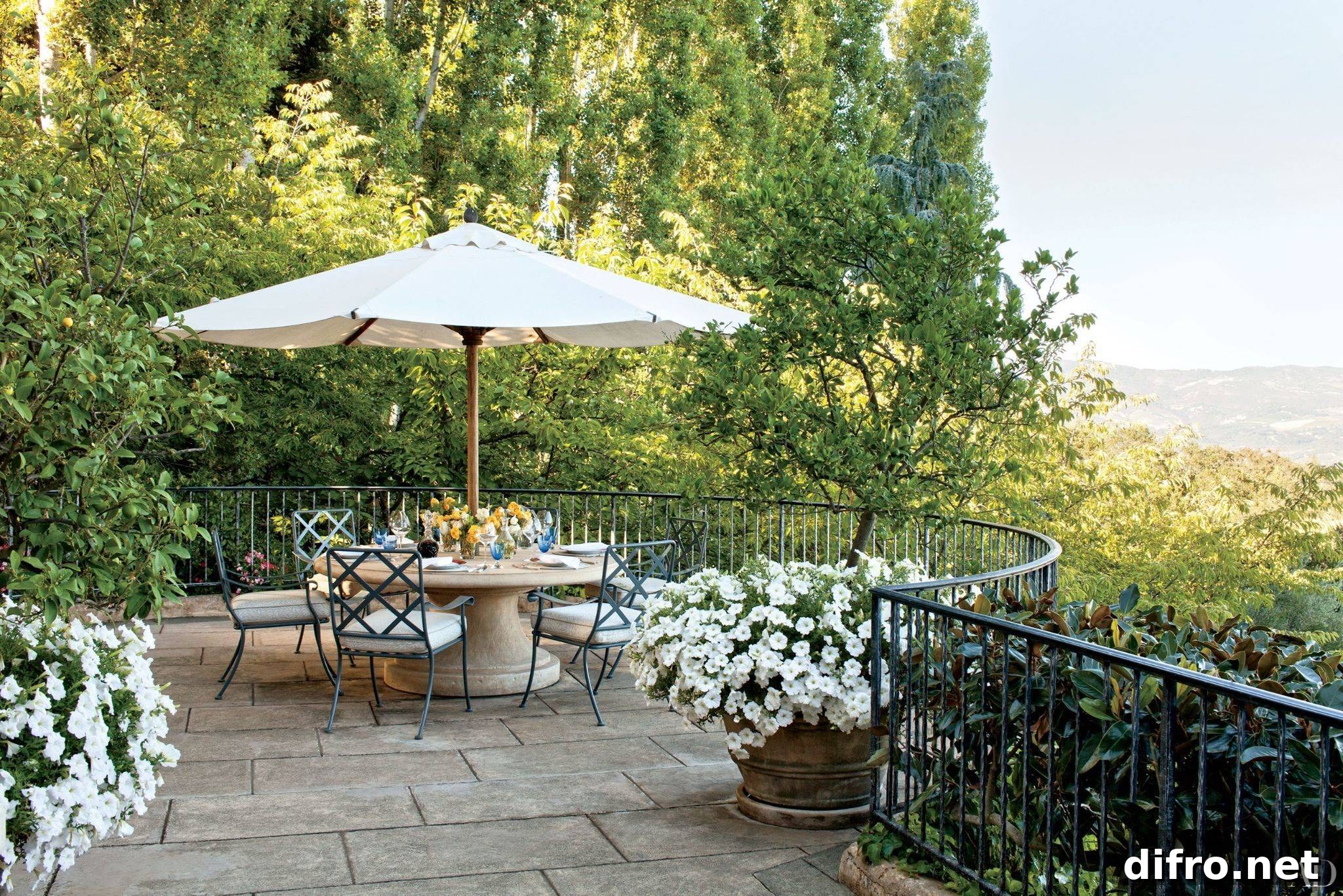seats on a balcony shaded by an outdoor umbrella