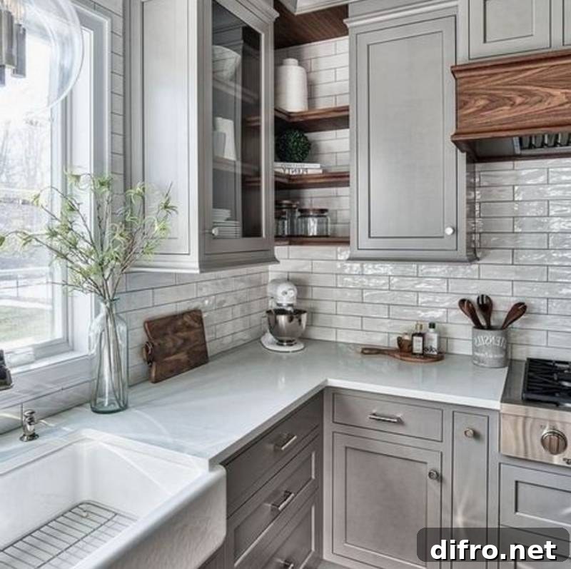grey granite countertops against grey cabinets and white backsplash