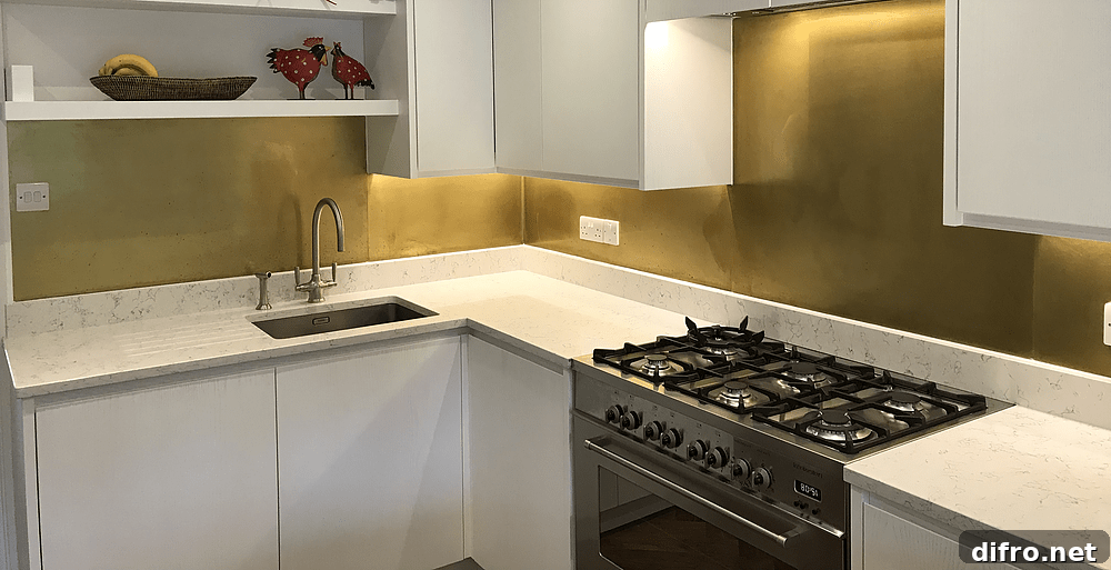 Modern Kitchen with White Cabinet and Brass Backsplash