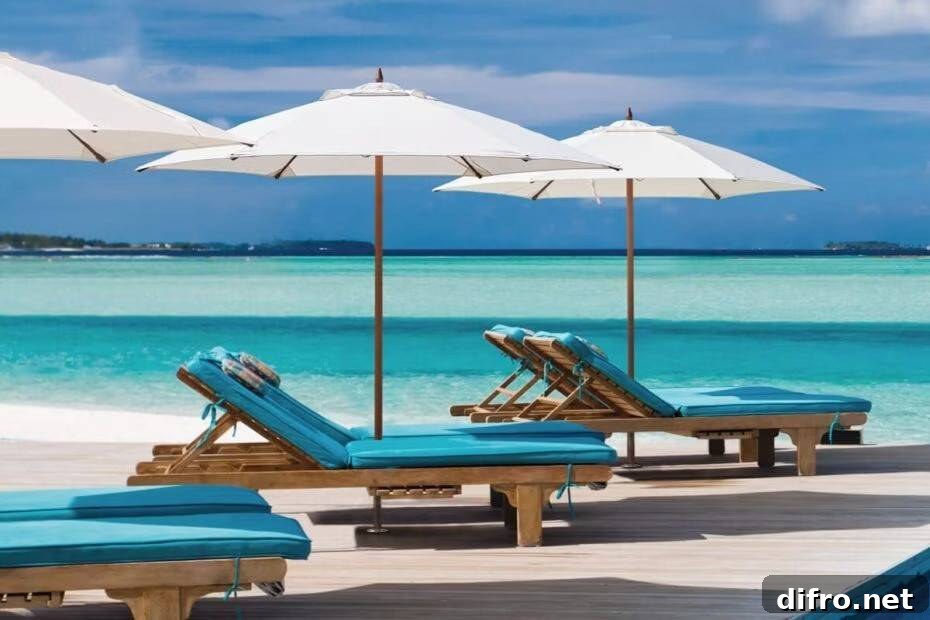 white patio umbrella on deck covering lounger