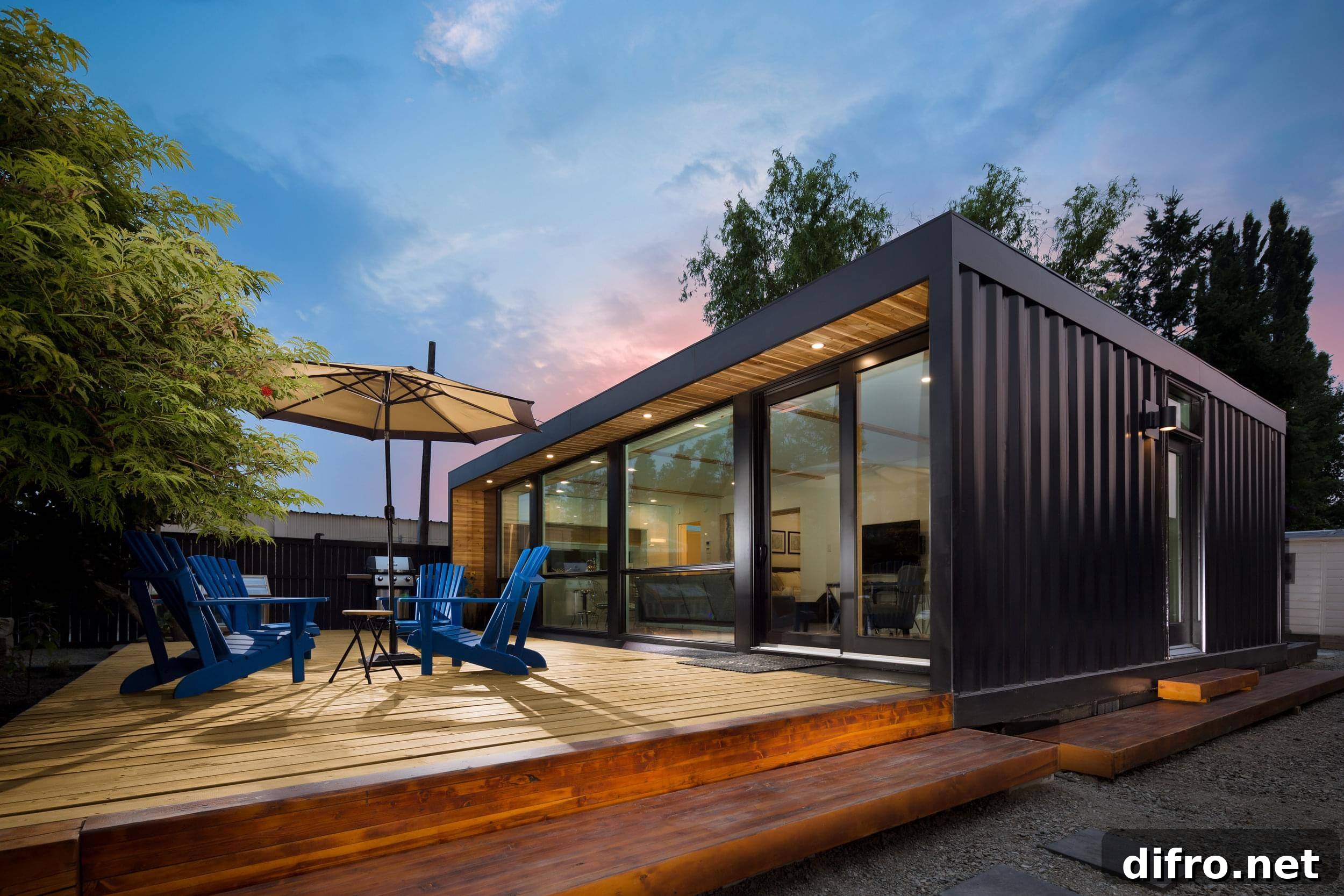 black steel container home with wooden patio